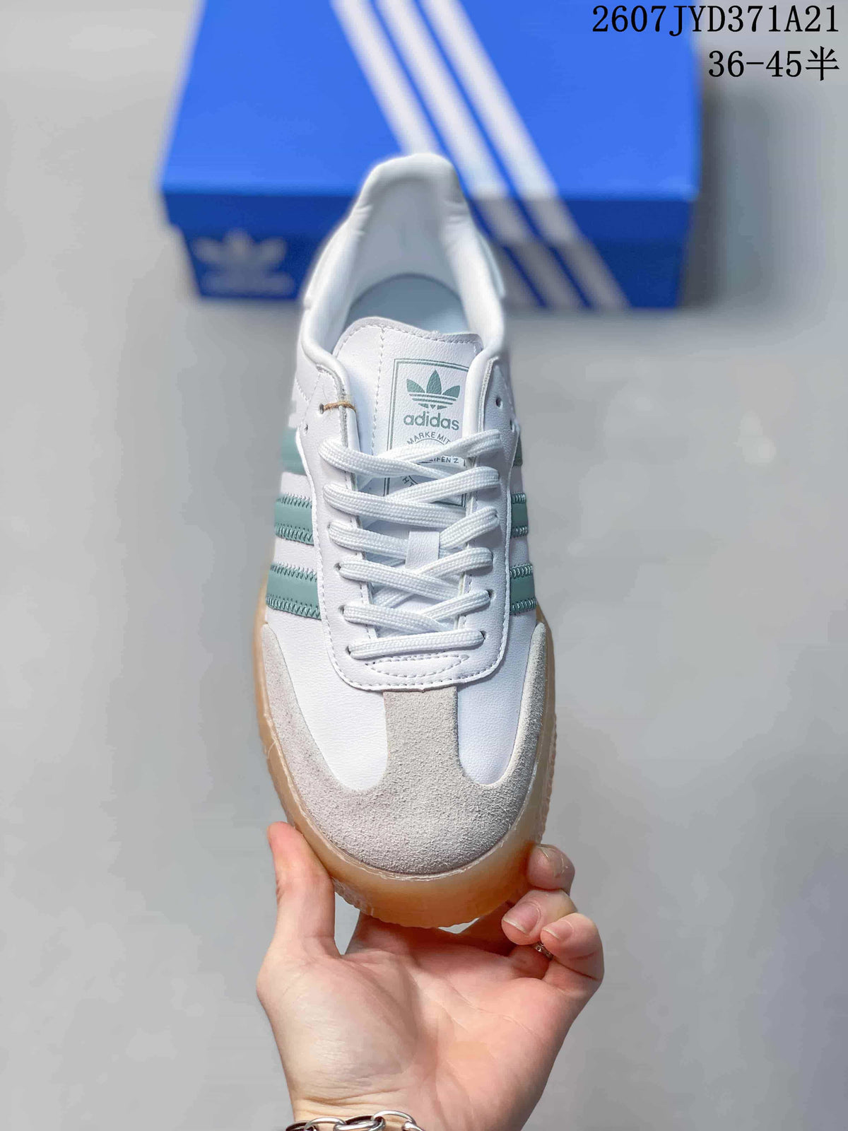 Top view showing white laces, the adidas tongue label, and gray toe panels.