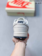 Rear view showing the white heel panel, layered stitching and dark outsole edge.
