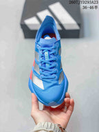 Top view of the blue lace-up sneaker showing the patterned upper, silver overlays and branded tongue.