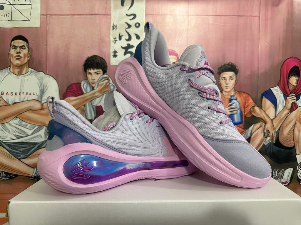 Pair of gray and pink Kyrie basketball shoes shown from side and angled views.