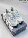 Pair of light gray and pale blue Adidas Holo Peak trail running shoes on a shoebox