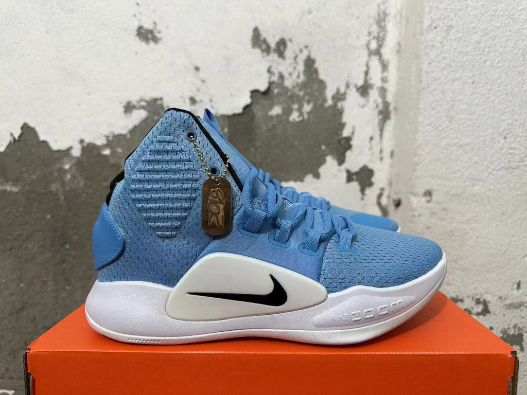 Side view of a blue basketball shoe with a black Swoosh and white midsole.