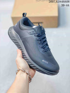 Angled side view of a dark gray ECCO lace-up sneaker