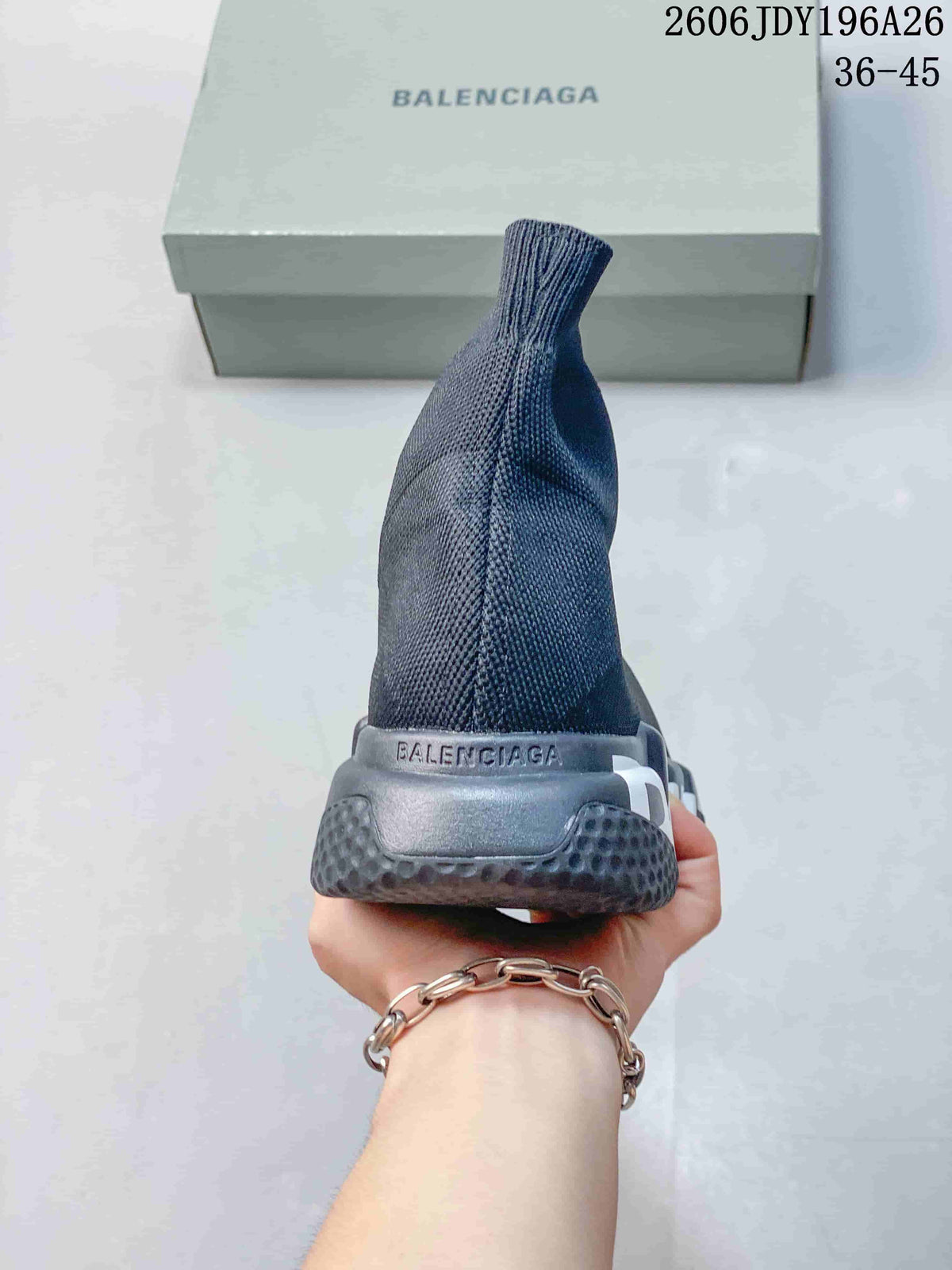 Rear view of a dark gray sock-style sneaker showing the high knitted collar, heel structure and Balenciaga branding.
