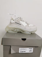 White Balenciaga sneaker displayed on its box, with the box label showing style code 541624 W09E1 9000 and EU 41.