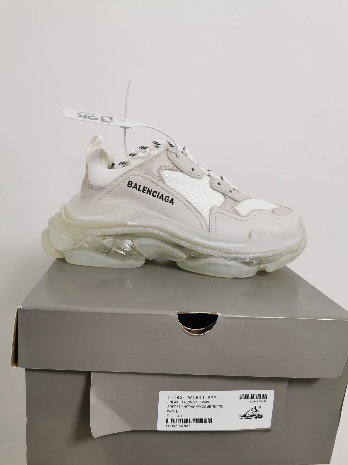 White Balenciaga sneaker displayed on its box, with the box label showing style code 541624 W09E1 9000 and EU 41.