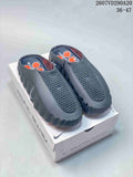 Pair of black and gray Nike Mind 001 slides displayed on a branded box; style code 2607VD290A20 and size range 36–47 are visible.