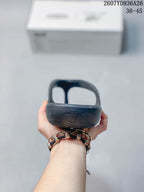 Rear view of the black flip-flop sandal showing the raised heel area and molded sole profile.