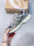 Side view of the Asics GEL-Kayano 14 sneaker showing mesh panels, layered overlays, and the segmented midsole.