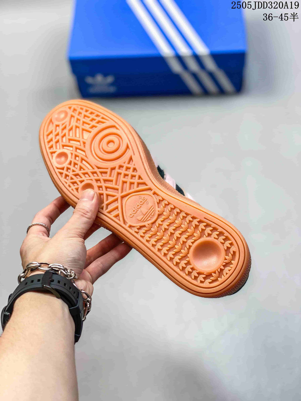 Close-up of the gum-colored outsole showing its patterned tread and adidas branding.