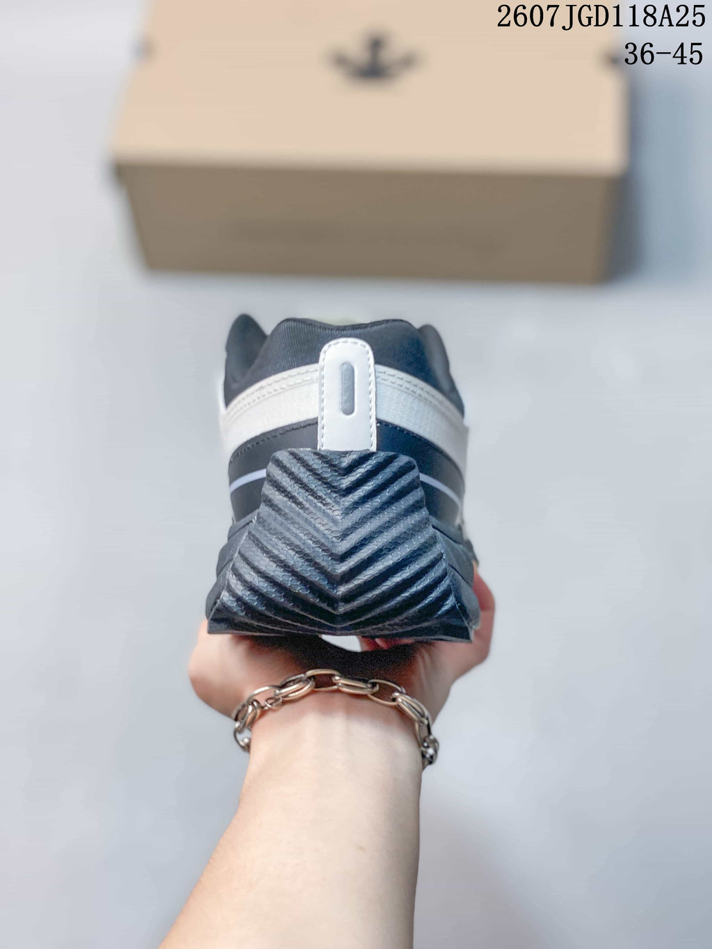 Rear view highlighting the layered black-and-white heel construction and textured heel outsole.