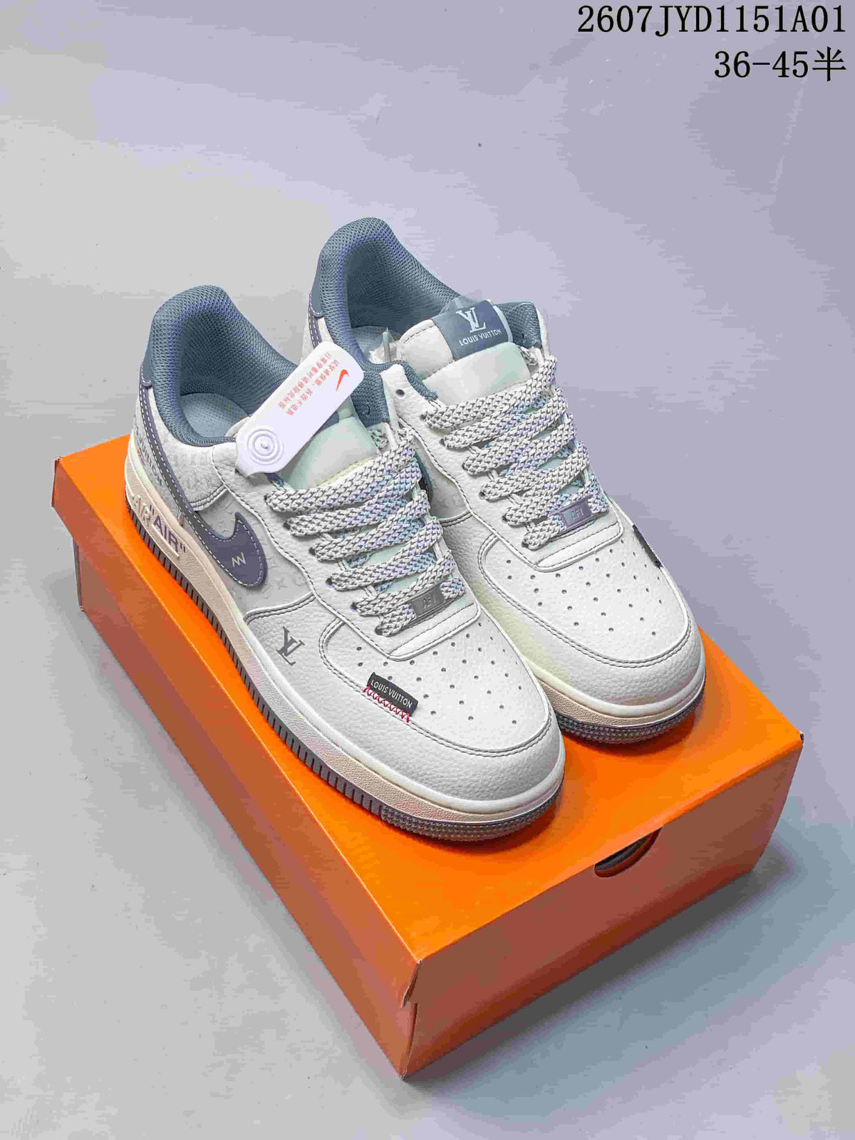 Pair of white low-top sneakers with gray accents and patterned panels