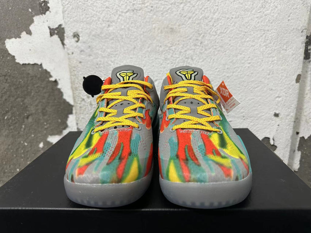 Front view showing the patterned upper, yellow laces, and gray tongue details