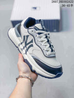 Three-quarter side view of the MLB sneaker showing the large side logo, contrasting navy overlays, and chunky sole.