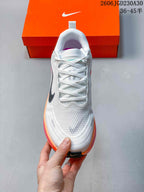 Top view showing the white laces, tongue, and textured toe area.