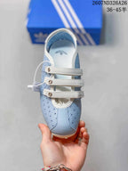 Top view showing the rounded toe, perforated panels, white trim and three adjustable straps.