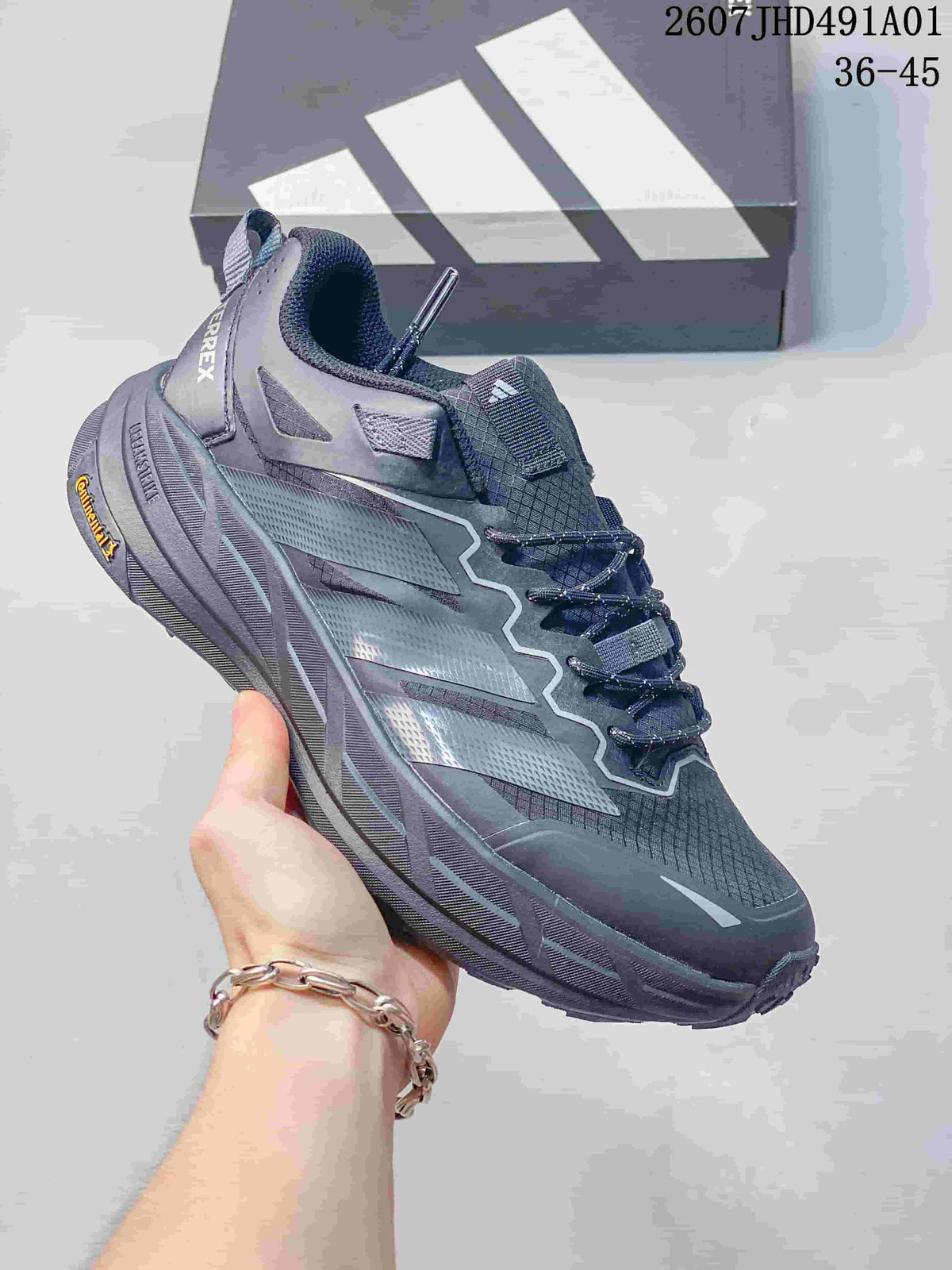 Dark gray Adidas Terrex low-top shoe with a light-colored sole; image displays the size range 40–45.
