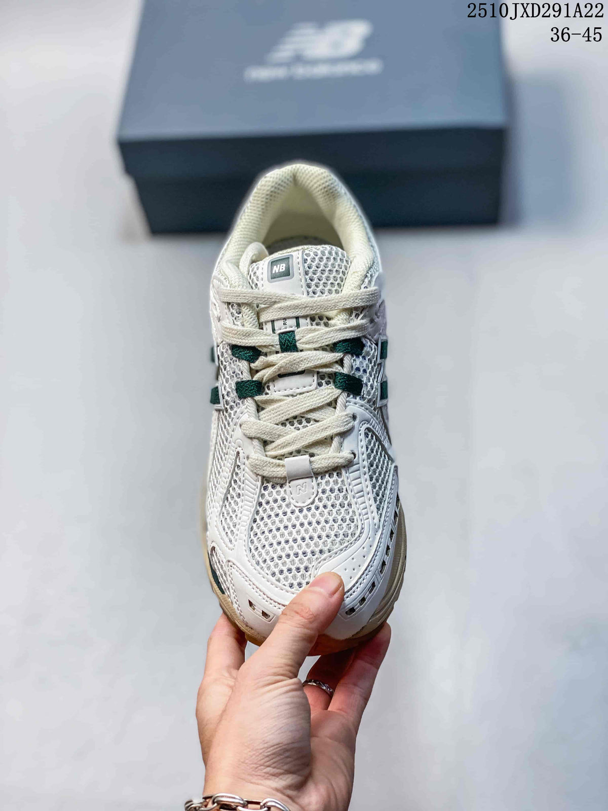 Top-down view of the mesh toe and lacing on a New Balance 1906AD sneaker; image also shows the printed size range 36–45.