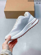Side profile of the white and pale lavender lace-up sneaker.