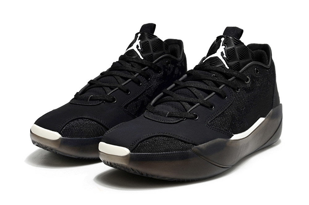Pair of black Jordan low-top sneakers with white tongue logos.