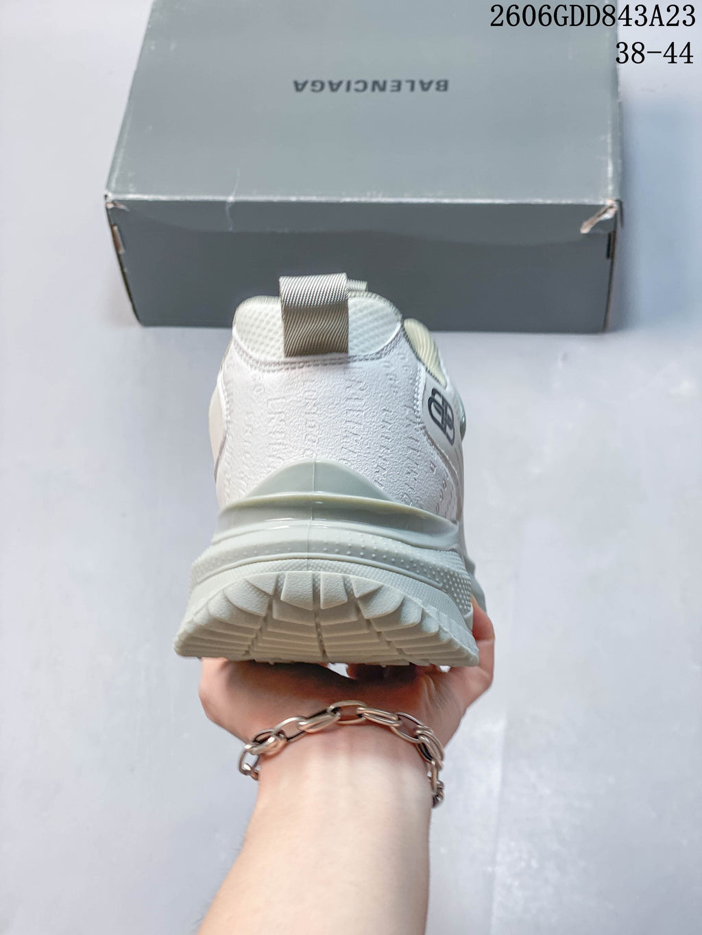 Rear view of the sneaker showing the heel, pull tab, and chunky outsole.