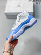 Side profile showing the glossy blue mudguard, white upper panels and translucent blue outsole.