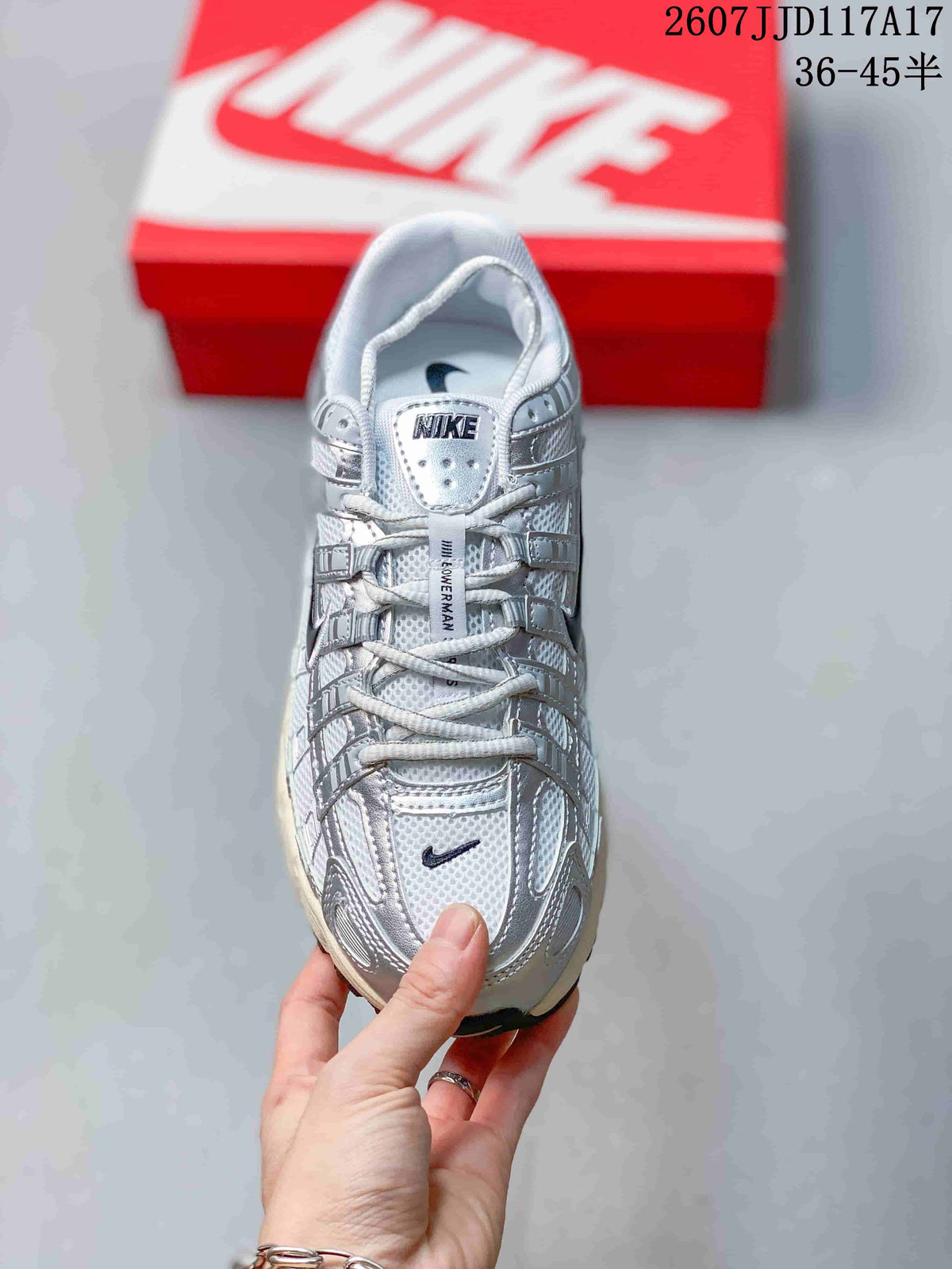 Top view showing the laces, padded tongue, perforated-looking upper panels, and toe branding.