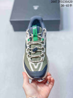 Top view showing the lace system, green tongue pull tab, navy toe guard and contrasting upper panels.