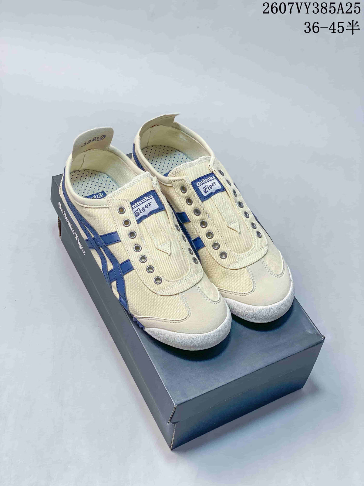 Pair of cream and blue Onitsuka Tiger slip-on sneakers displayed on a shoebox, with style code 2607VY385A25 and size range 36–45 shown above.