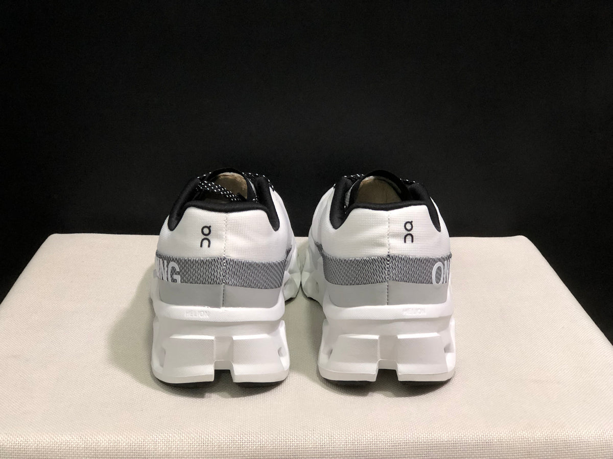 Rear view of the white On Cloudmonster 2 shoes