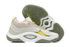 Beige, white, and green-accented Nike Anthony Edwards 3 shoes, with outsole view