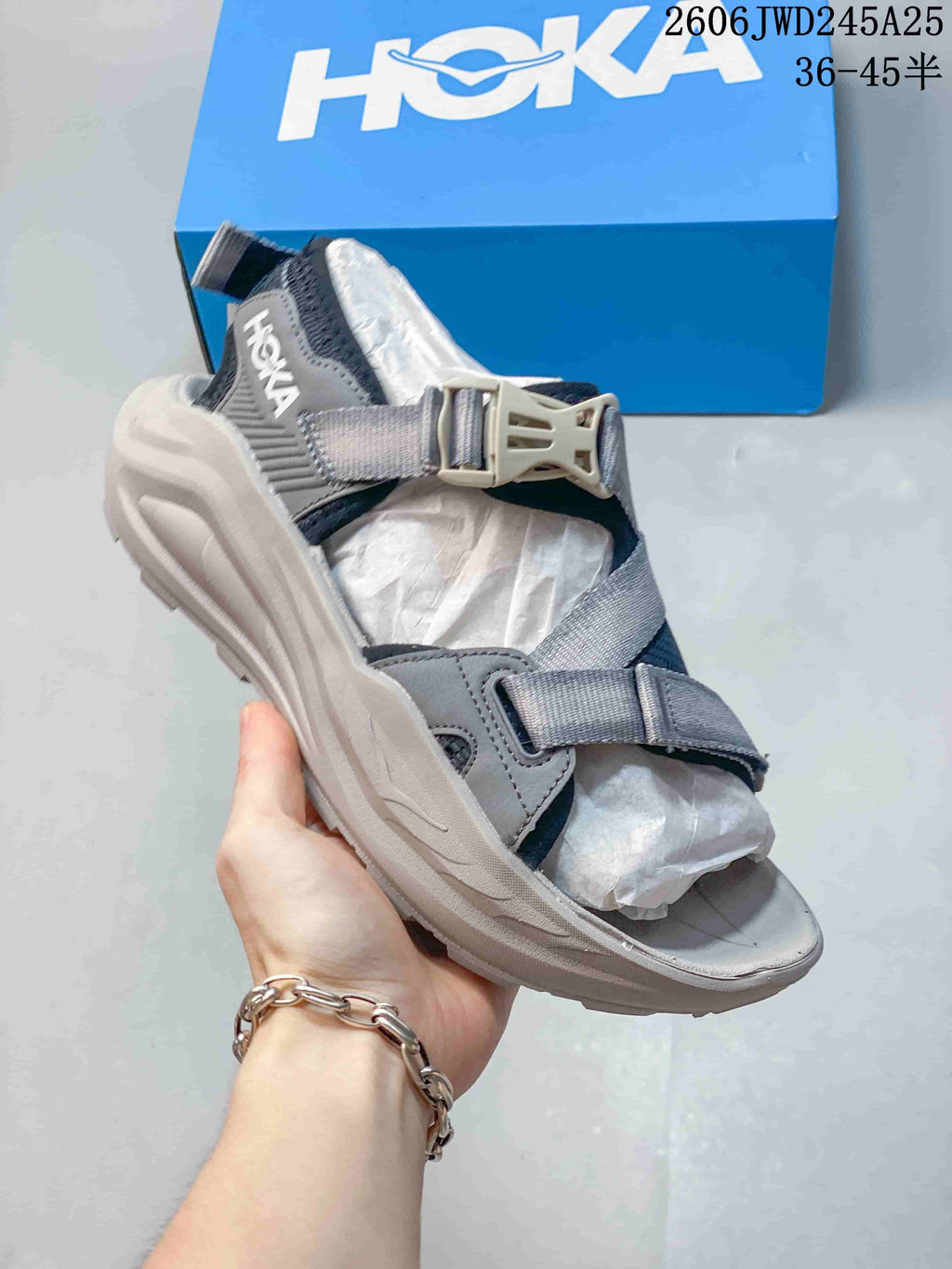 Gray and dark navy HOKA Infini Hike TC sandal with buckle closure