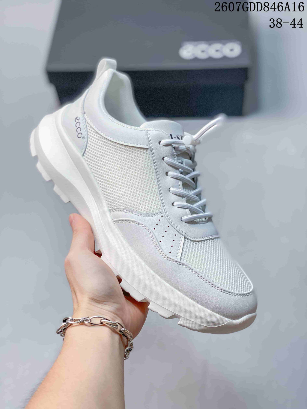 Angled side view of the white ECCO sneaker highlighting the mesh-look upper panels and raised outsole.