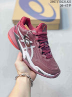 Angled side view of the burgundy ASICS tennis shoe showing the white side logo, layered midsole, and red outsole accents.