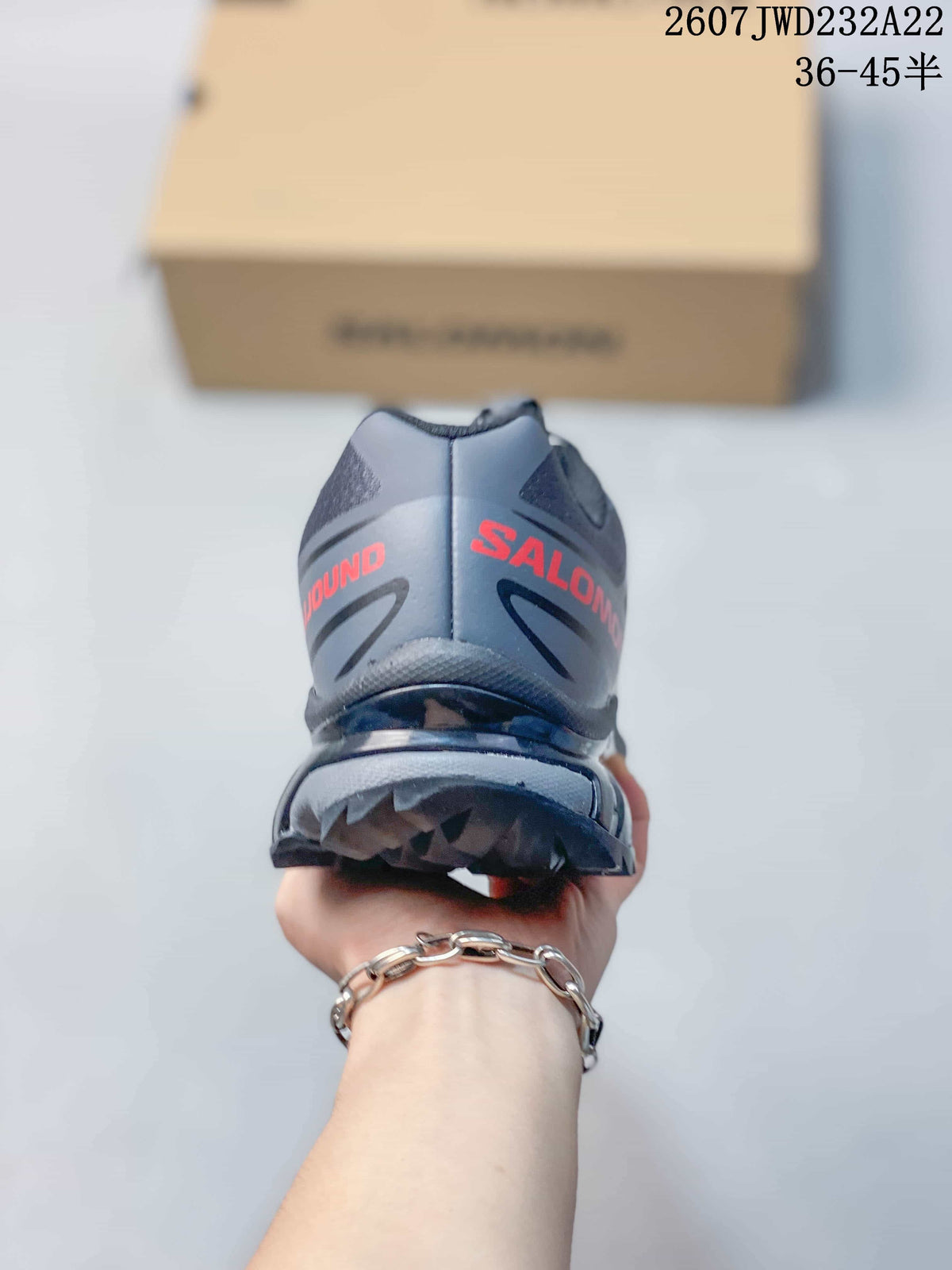 Rear view showing the padded heel, red Salomon branding, and raised outsole tread.