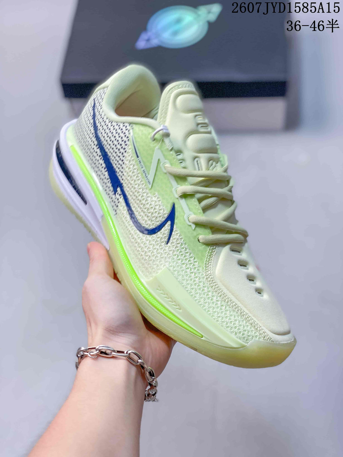 Angled side view of the Nike basketball shoe showing the mesh upper, blue swoosh, bright green midsole accent, and translucent outsole.