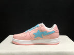 Side profile of one pink Bape Sta sneaker showing the large light-blue star side panel and layered white midsole.