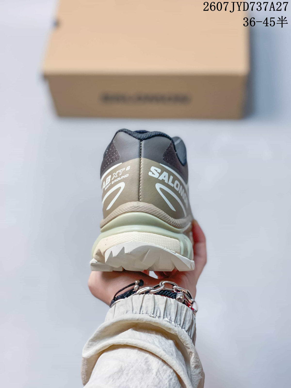 Rear view showing the structured heel, Salomon branding, and layered outsole.