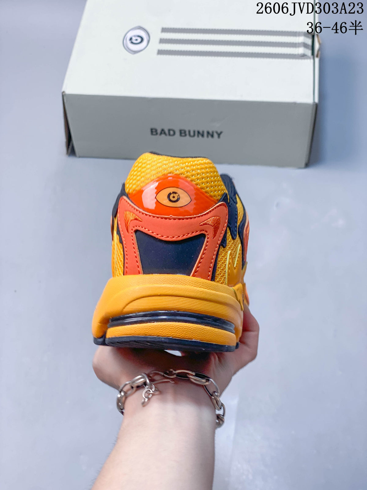 Rear view showing the layered heel design and graphic tongue detail
