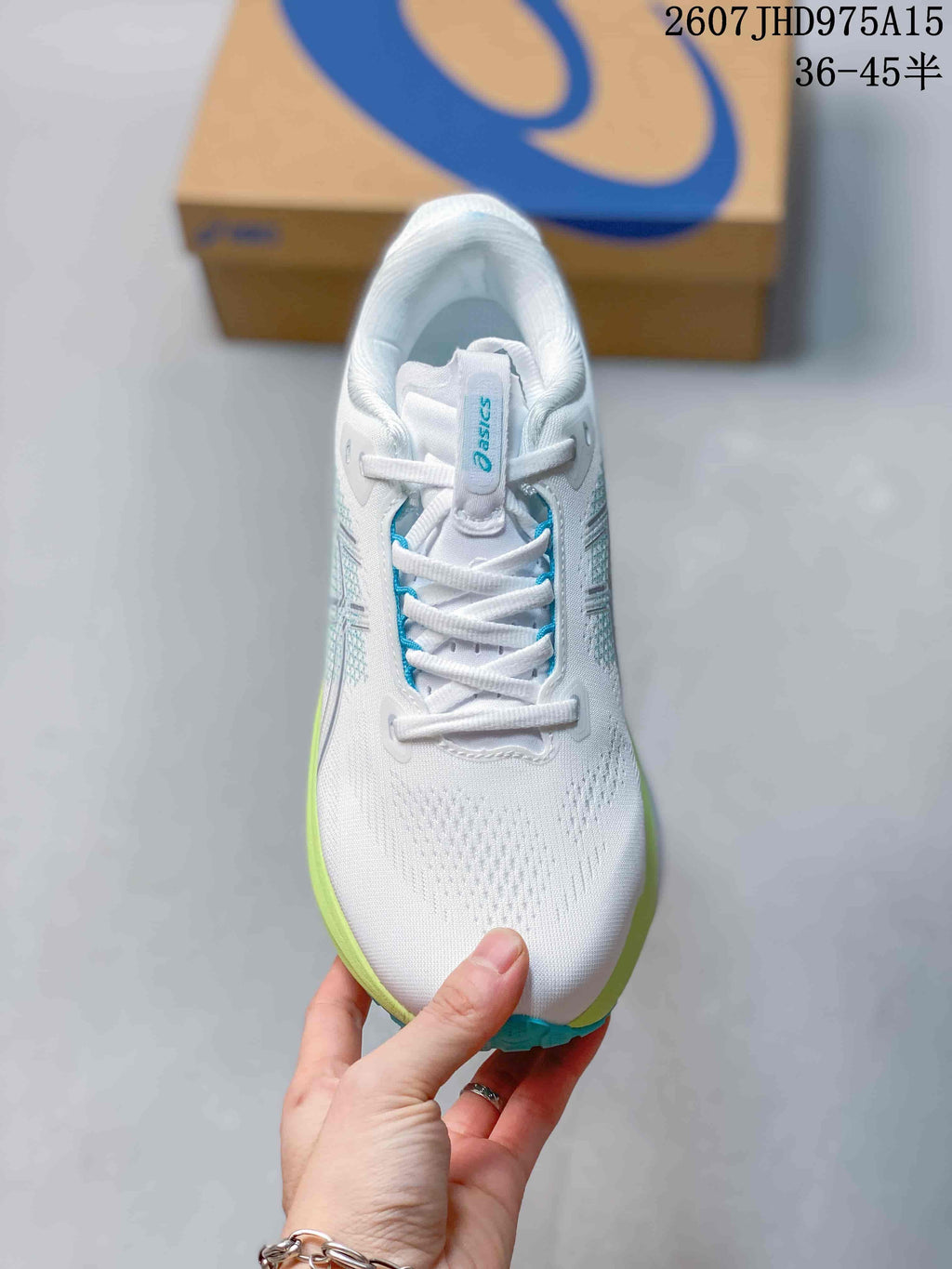 Top view showing the white lace-up upper, padded collar, and blue detailing around the tongue and eyelets.