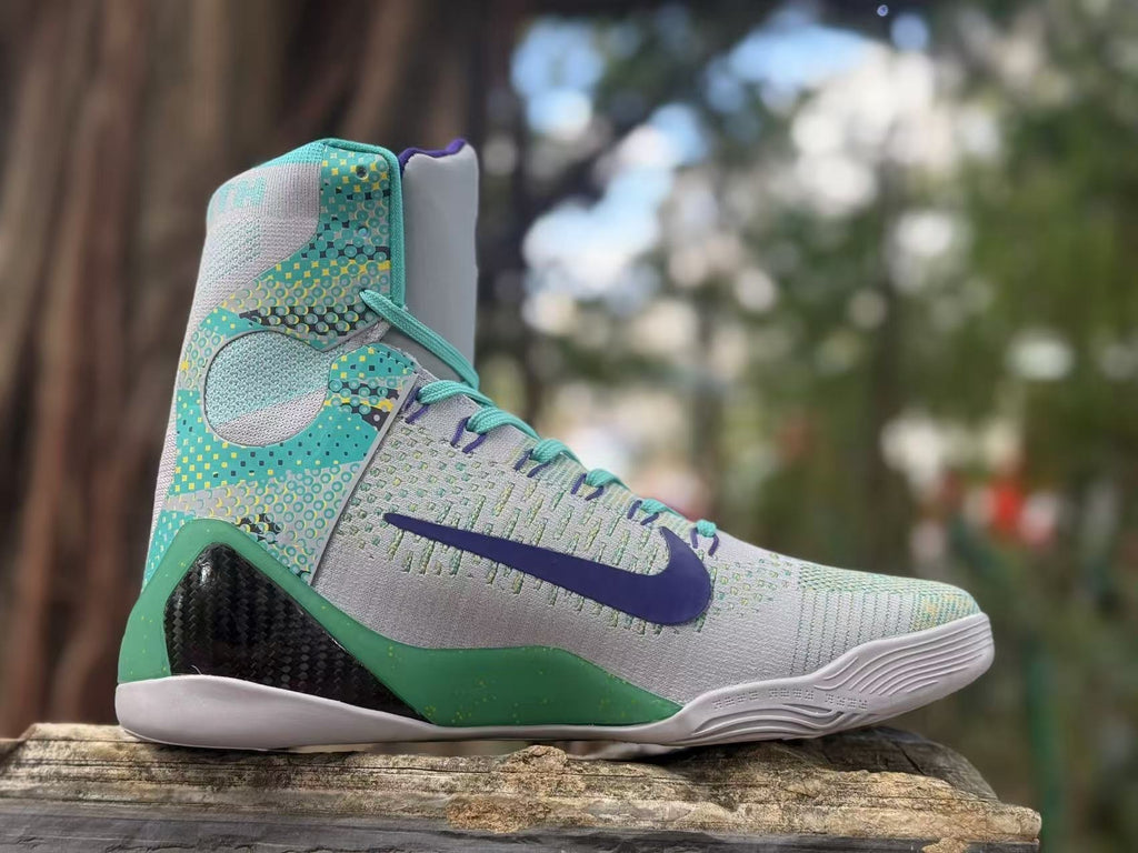 Opposite side view showing the patterned turquoise panels and purple Swoosh