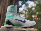 Opposite side view showing the patterned turquoise panels and purple Swoosh