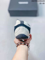 Rear view of the sneaker showing the contrasting heel panels and Chanel logo detail.