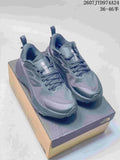 Pair of dark gray The North Face Altamesa 500 sneakers displayed on a shoe box, with the source range and style code overlaid above.