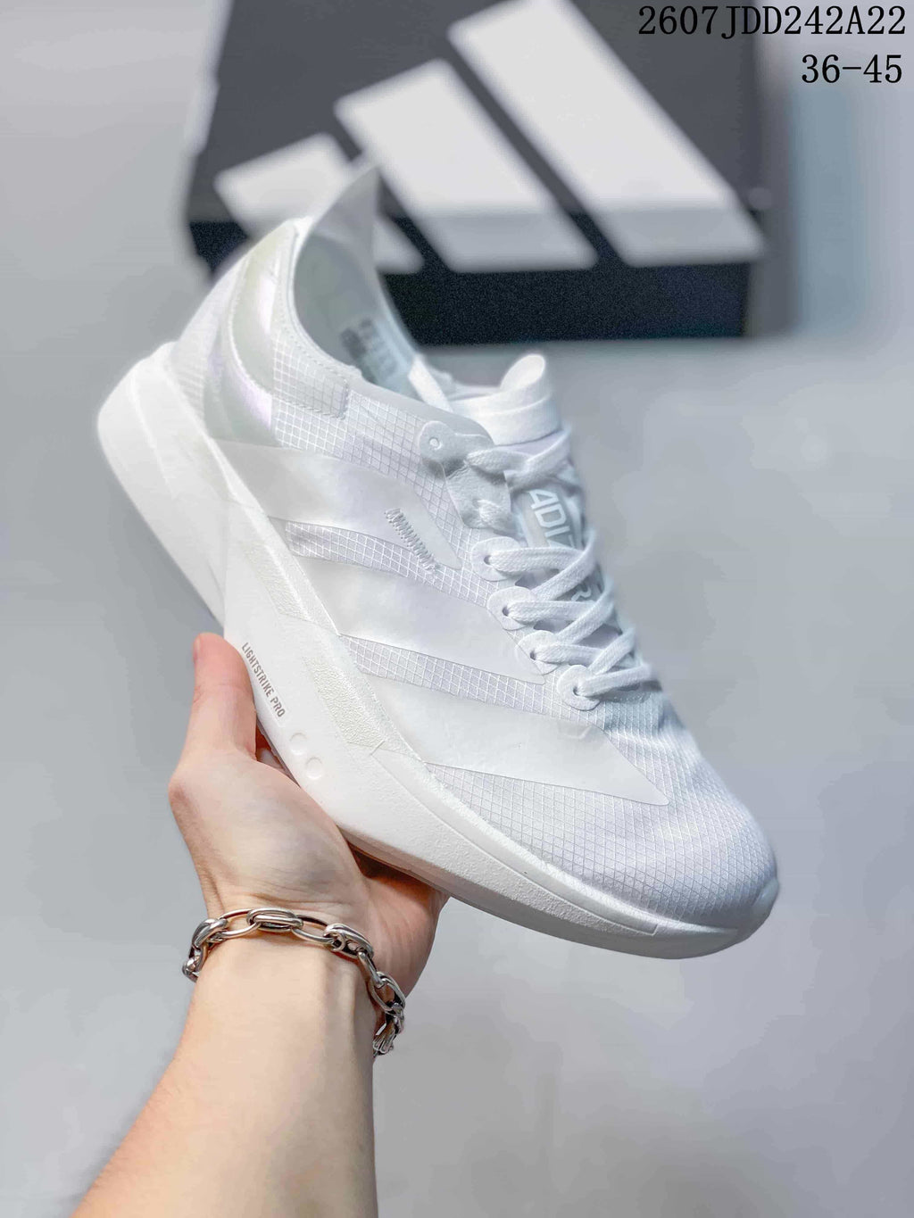 White Y-3 Adios Pro 4 sneaker with subtle white-on-white side overlays; image text shows JDD242A22 and sizes 36–45.