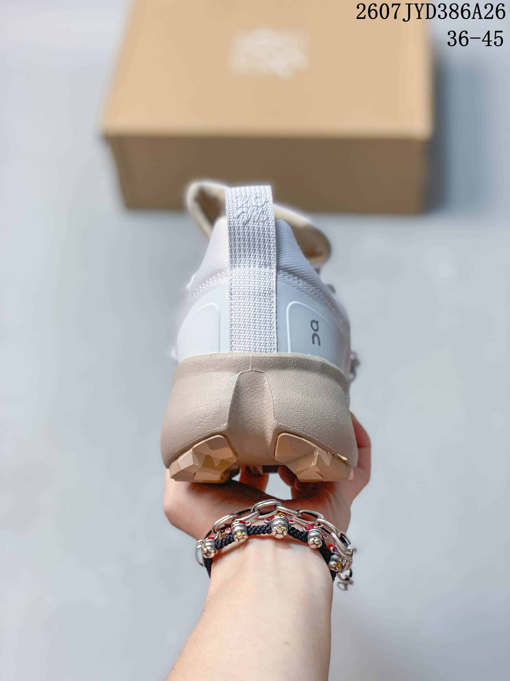 Rear view of the sneaker showing the padded heel, pull tab, sculpted midsole, and outsole lugs.