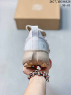 Rear view of the sneaker showing the padded heel, pull tab, sculpted midsole, and outsole lugs.