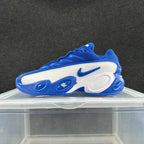 Side view of a blue and white Nike Zoom Flight 95 sneaker with oval midsole details.