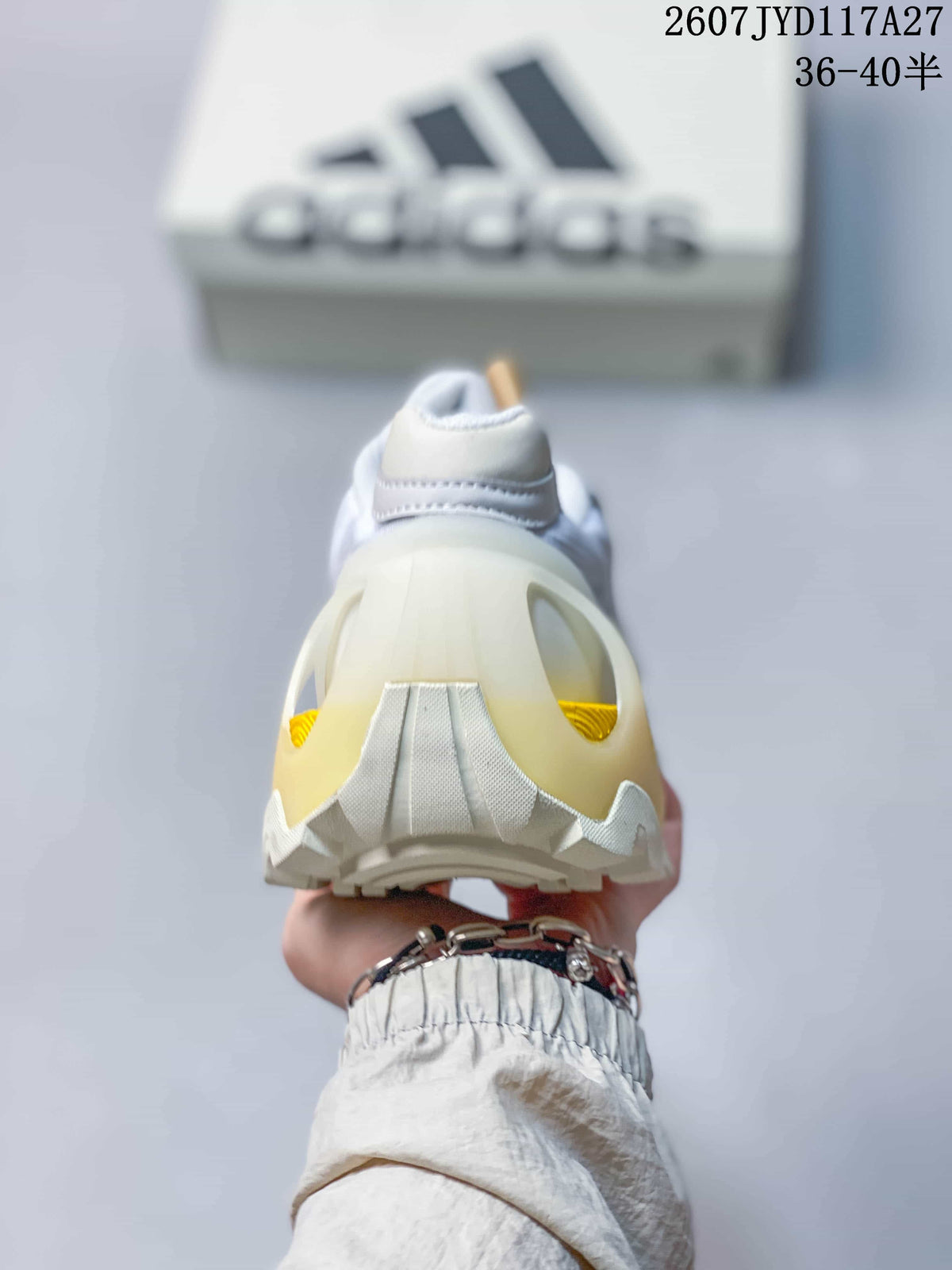Rear view showing the padded heel, sculpted heel structure, and yellow outsole insert.