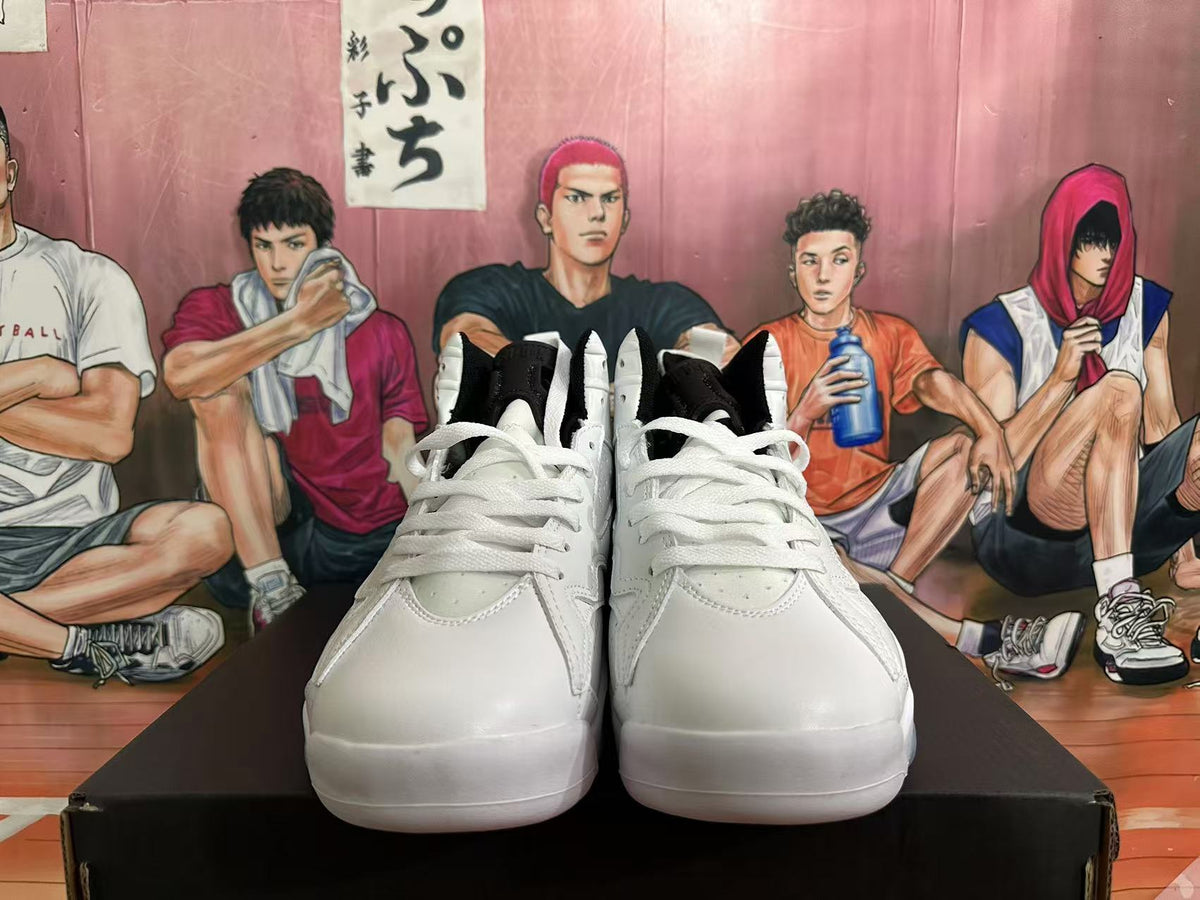 Front view of white high-top sneakers with white laces and black collar lining.